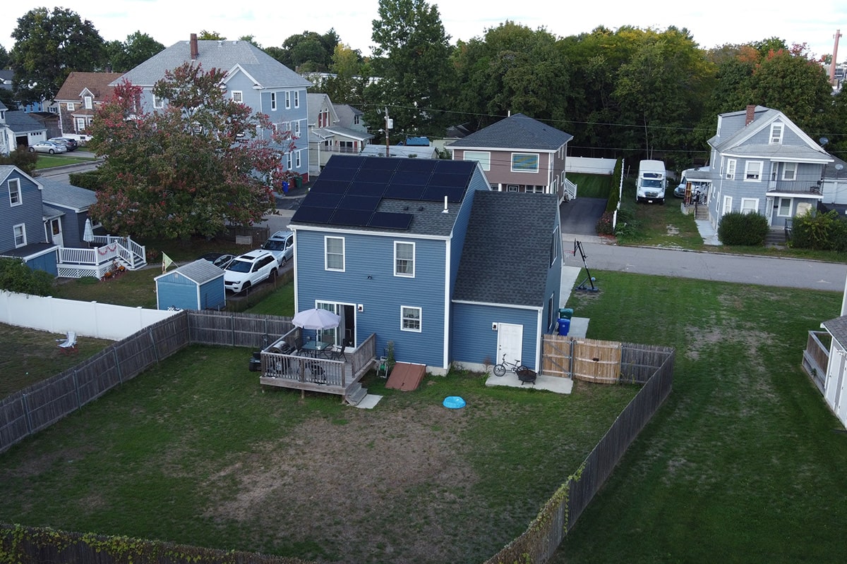 Here is an image of NH residential solar panels, taken from a drone camera. Our NH solar company installs solar panels on the roof of the house or property.
