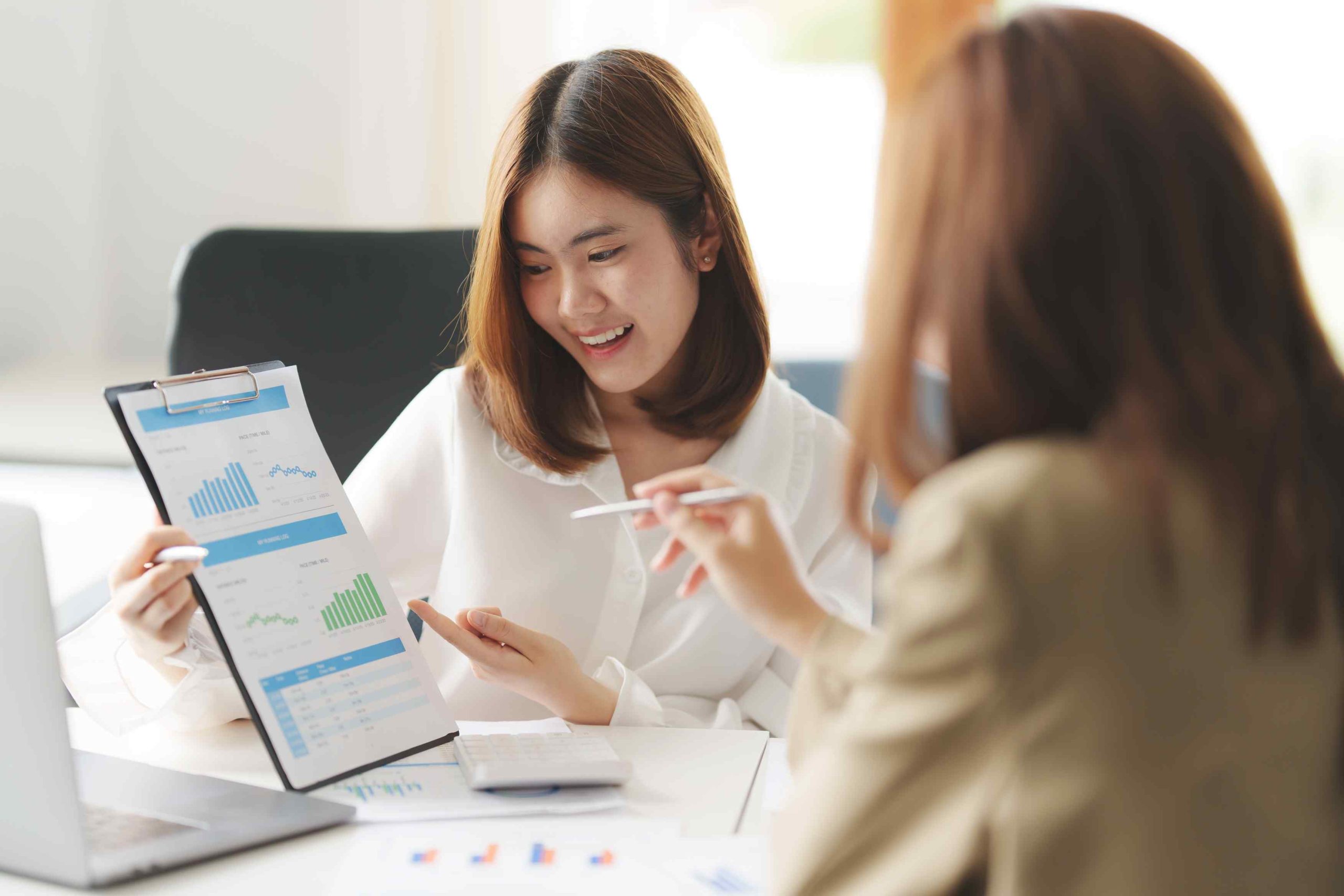 Picture of a representative presenting a proposal to a homeowner