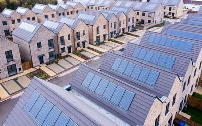 Arial view of new Homes in UK with Solar installations. Summit Solar deals in Solar Panel installations.