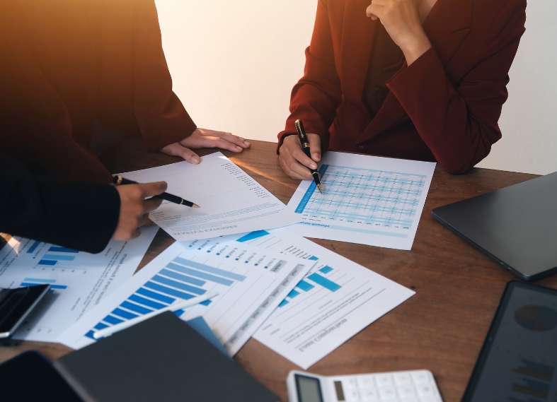 Here is a picture, taken from a drone, that shows a group of MA solar installers. They are standing in a parking lot and they are holding an Inc. 5000 sign given to Summit Energy.